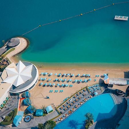 Hotel Hilton Ad Dawhah Esterno foto Aerial view of the beach