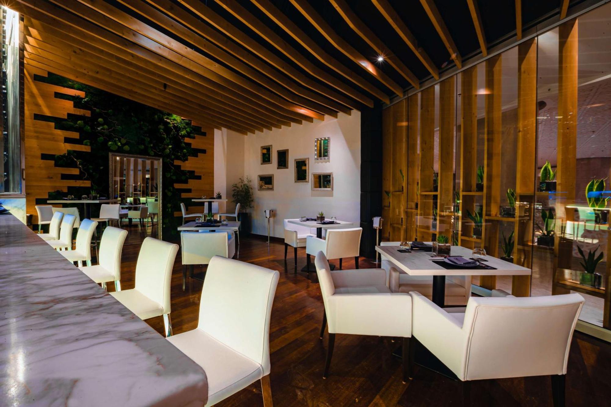 Hotel Hilton Ad Dawhah Esterno foto Restaurant